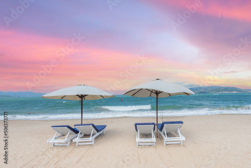 Nha Trang beach with umbrellas and chairs  © loc