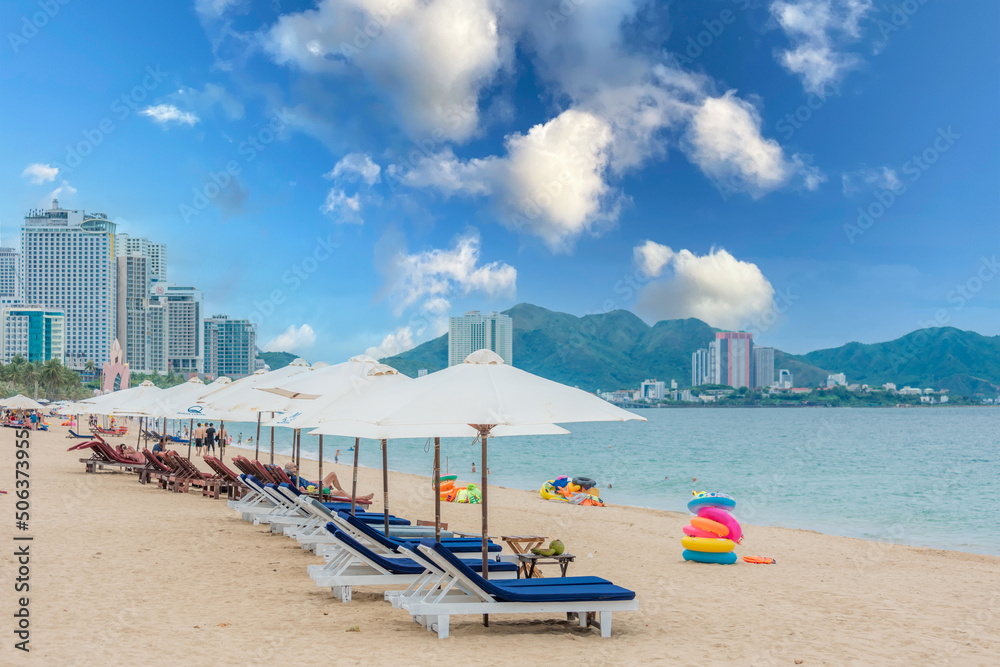Nha Trang beach with umbrellas and chairs 