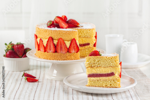 Piece of French Fraisier Cake. Fruitcake made with two layer of Genoise Sponge, Diplomat Cream, strawberry jelly layer and Fresh Strawberries. photo