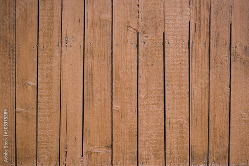 Red Brown wooden background . Close up view . Old fence texture