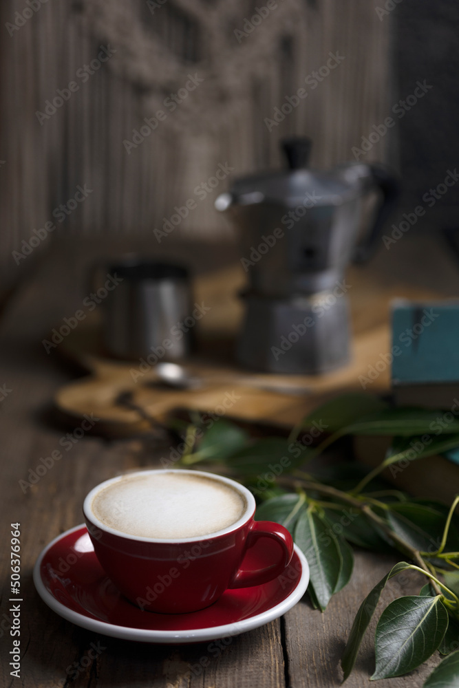 a cup coffee and moka with milk jug