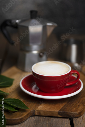 a cup coffee and moka with milk jug
