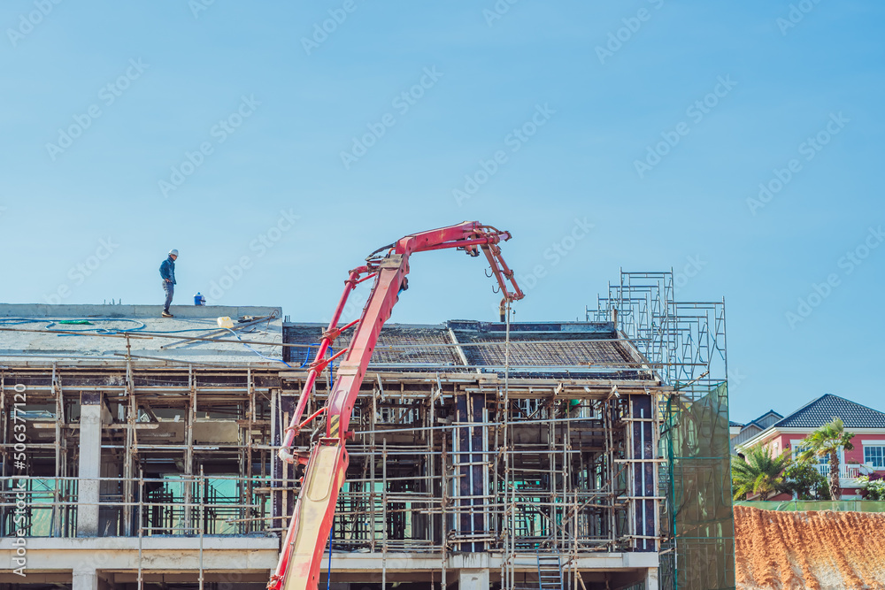 Technical modern telescopic self erection crane. Concrete multistorey new house residential