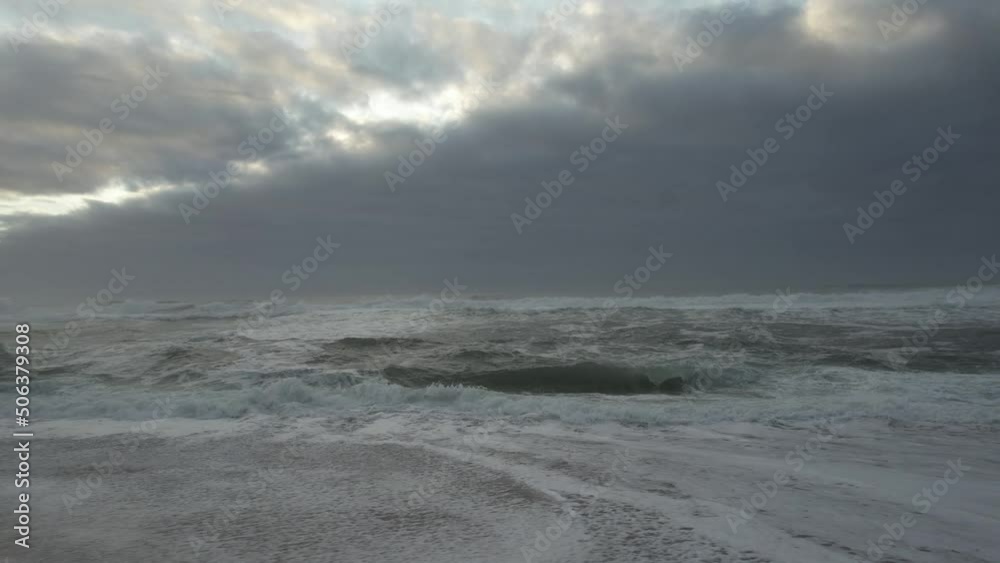 Storm Waves on Beach at Sunset
