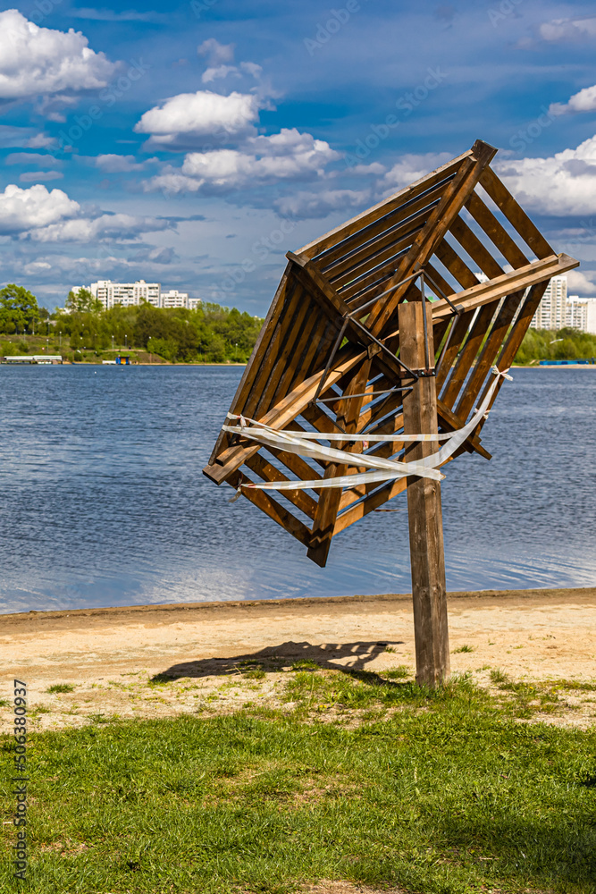 wooden umbrella with damage on the city beach (Corrected) wooden umbrella with damage on the city beach (Corrected)