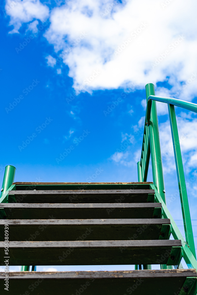 staircase with wooden steps looking up to the sky (Corrected)