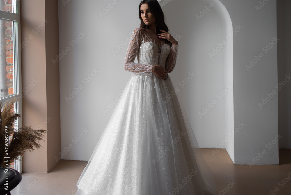 portrait of beautiful bride in wedding dress with fashion hairstyle and make-up portrait of beautiful bride in wedding dress with fashion hairstyle and make-up