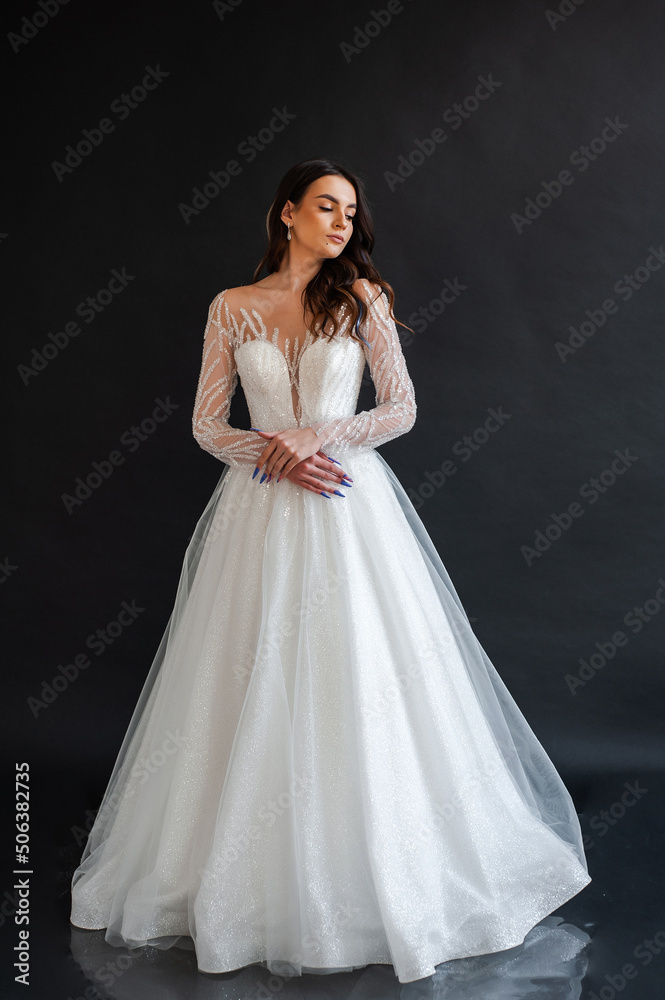 portrait of beautiful bride in wedding dress with fashion hairstyle and make-up portrait of beautiful bride in wedding dress with fashion hairstyle and make-up