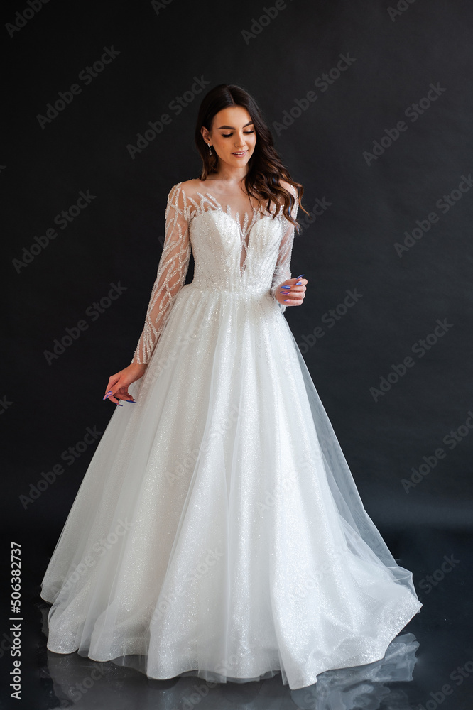 portrait of beautiful bride in wedding dress with fashion hairstyle and make-up portrait of beautiful bride in wedding dress with fashion hairstyle and make-up
