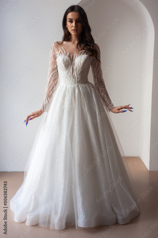 portrait of beautiful bride in wedding dress with fashion hairstyle and make-up portrait of beautiful bride in wedding dress with fashion hairstyle and make-up
