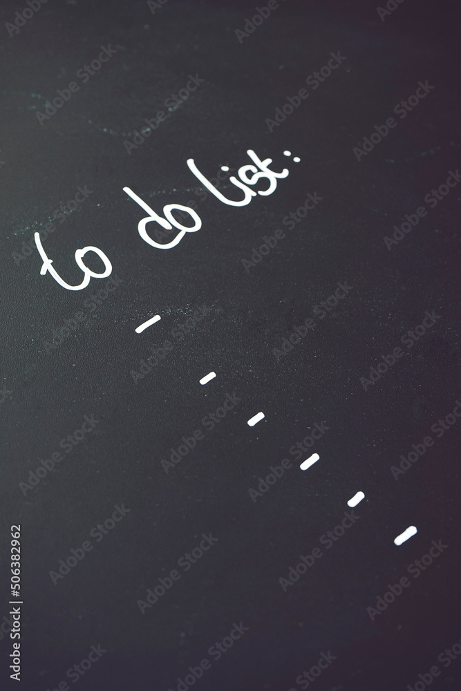 Fototapeta premium To do list writen in white against a black blackboard