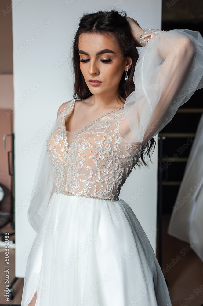 Beautiful bride perfect style. Wedding hairstyle make-up luxury wedding dress