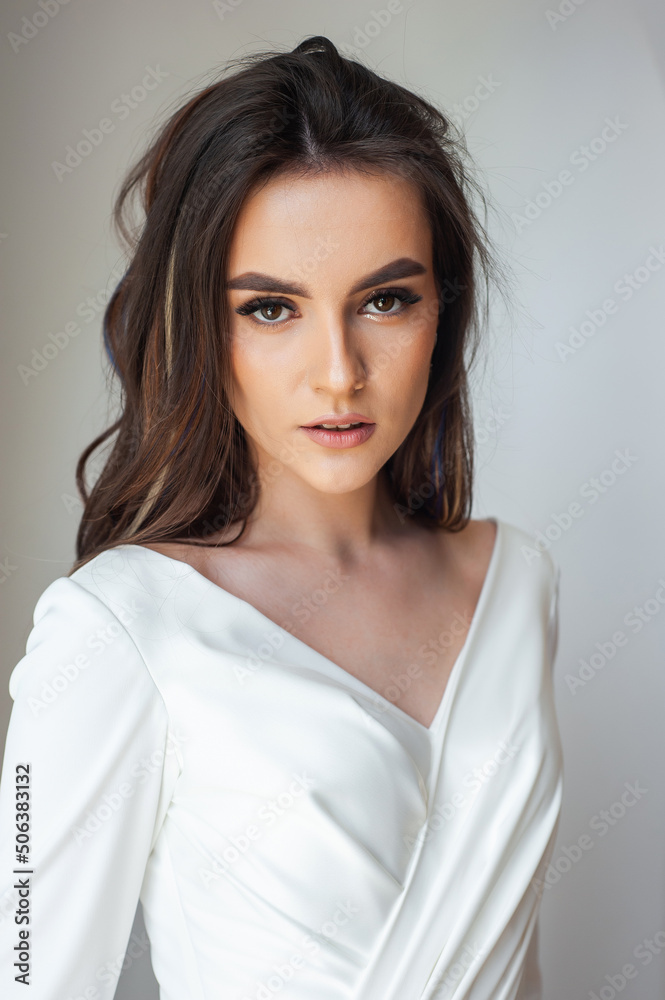 Beauty Portrait of bride wearing in wedding dress with voluminous skirt, studio photo. Young attractive bride. Smiling beautiful young bride Beauty Portrait of bride wearing in wedding dress with voluminous skirt, studio photo. Young attractive bride. Smiling beautiful young bride
