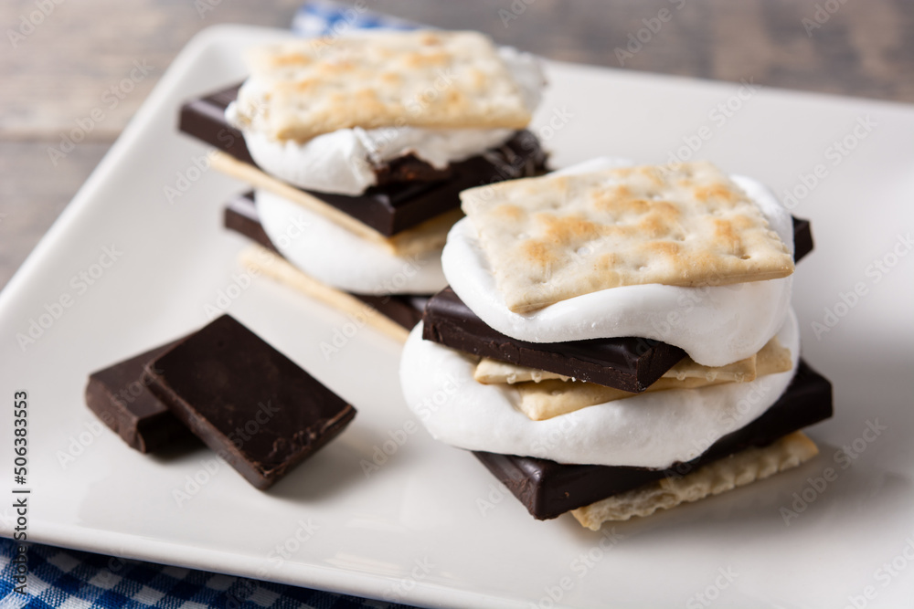 Homemade smores on wooden table. typical American sweet Homemade smores on wooden table. typical American sweet