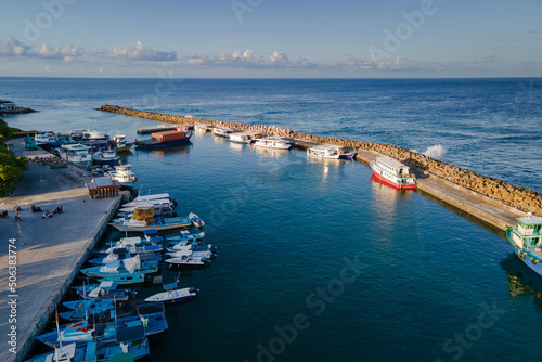 Aerial view of boat jetty at Fuvahmulah Harbour, fishing port and famous dive site for tiger sharks, Fuvahmulah Island, Gnaviyani Atoll or Nyaviyani Atoll, Maldives photo