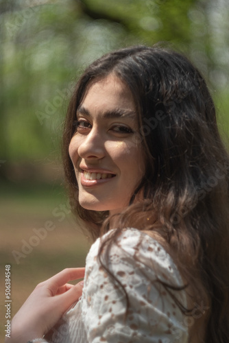 portrait of a young long hair woman smiling