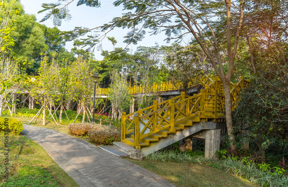 Old wooden bridge with stairs in park