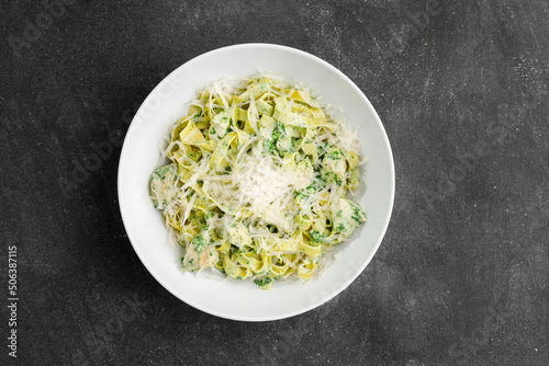 Pasta with pesto and parmesan cheese