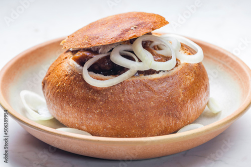 beef goulash in loaf of bread photo