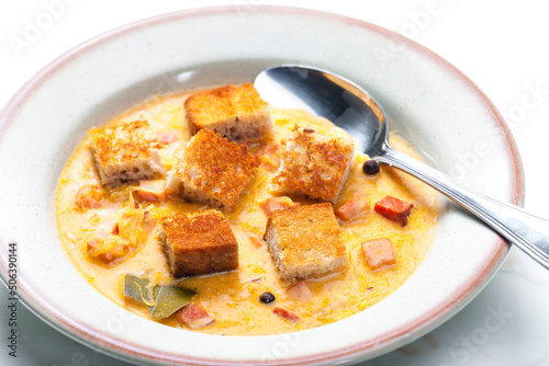 cabbage soup with smoked meat and toasted bread photo