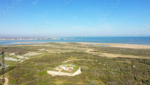 The redoubt of Merville facing the bay of the Orne in Europe, France, Normandy, Arromanches, in spring, on a sunny day. photo