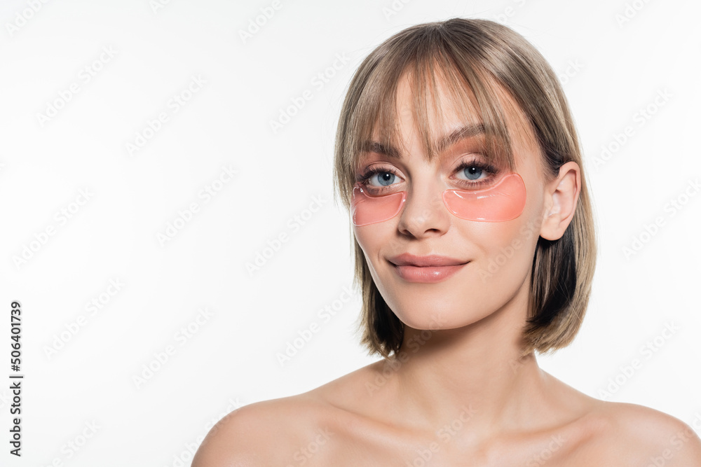 happy young woman with hydrogel eye patches isolated on white happy young woman with hydrogel eye patches isolated on white