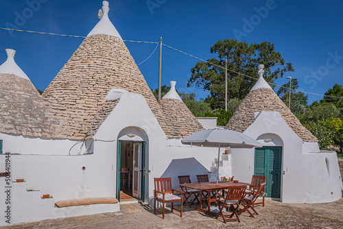 A trullo is a traditional Apulian dry stone hut with a conical roof.