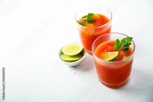 Homemade tomato cocktail with fresh lime