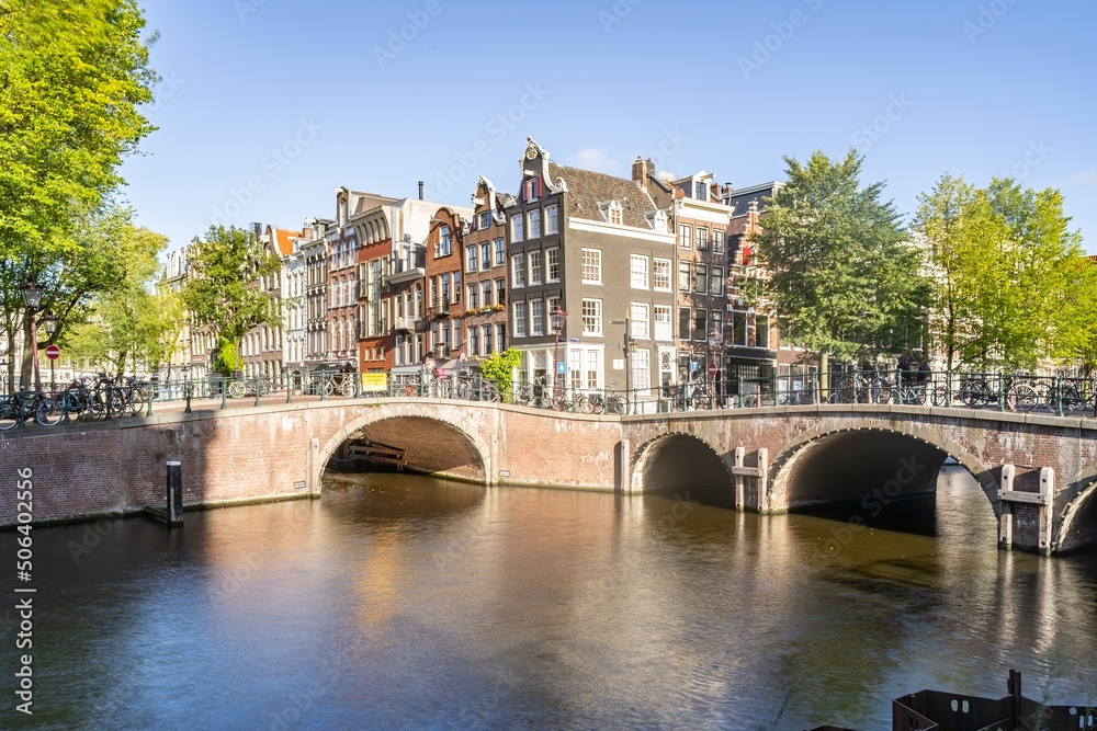 Amsterdam, Netherlands bridges and canals during a sunny day.