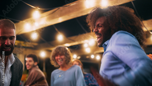 Close Up of Beautiful Carefree Friends are Dancing Together and Celebrating an Evening Event at a Party . Diverse Multiethnic Young Adult People Have Fun at a Corporate Party in a Restaurant.