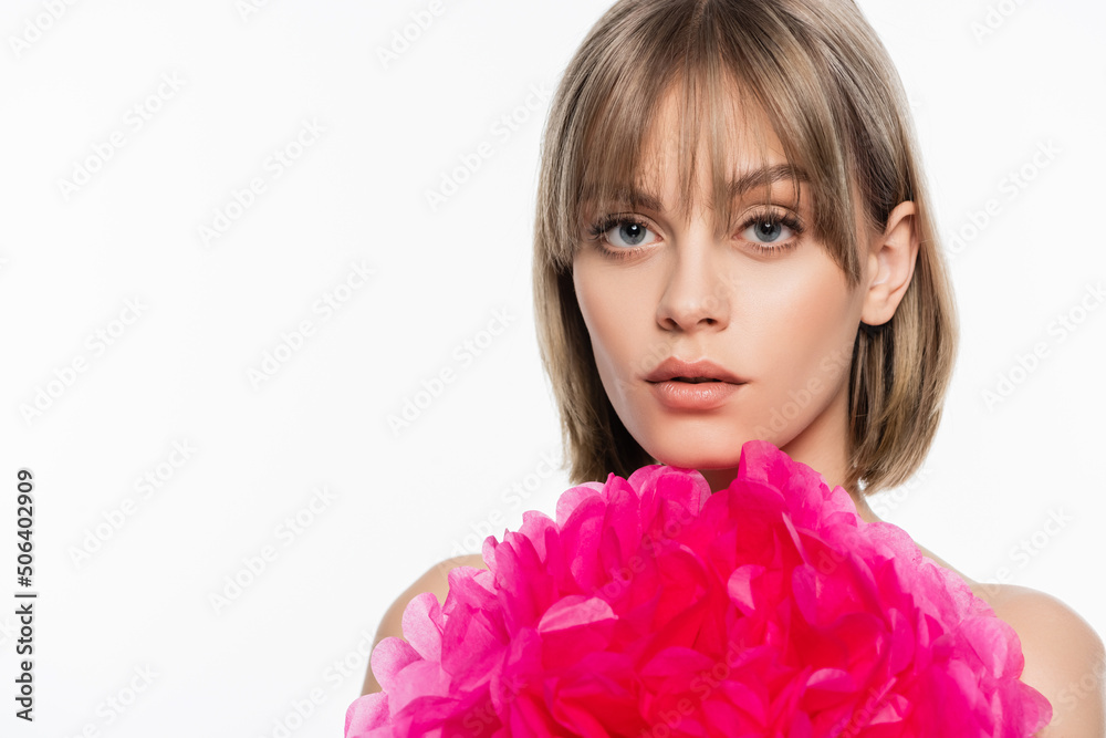 young woman with bangs near pink decorative flower isolated on white young woman with bangs near pink decorative flower isolated on white