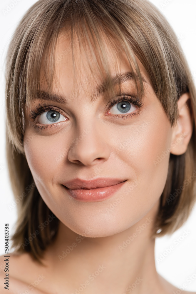 smiling woman with bangs and blue eyes looking up isolated on white smiling woman with bangs and blue eyes looking up isolated on white