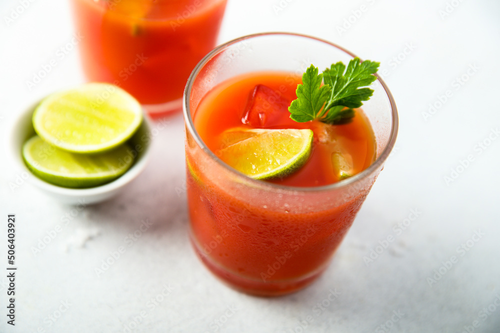 Homemade tomato cocktail with fresh lime