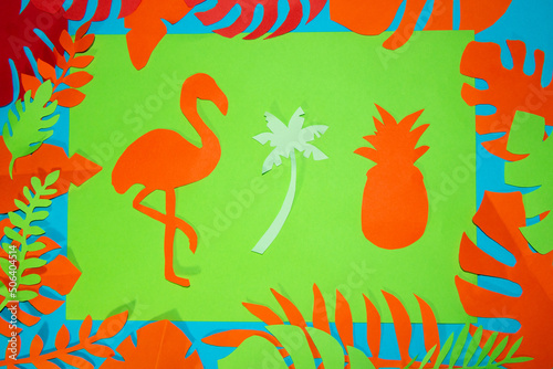 paper flamingo palm and pineapple on a green background  around tropical leaves  jungle design