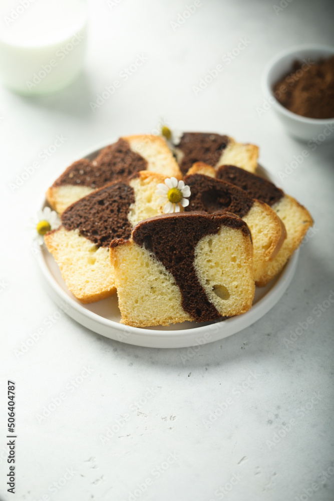 Homemade vanilla chocolate marbled cake on a plate Homemade vanilla chocolate marbled cake on a plate