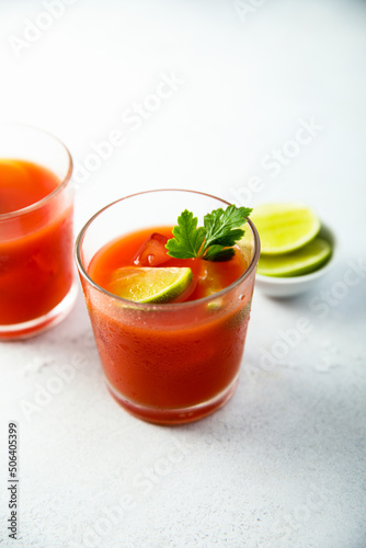 Homemade tomato cocktail with fresh lime