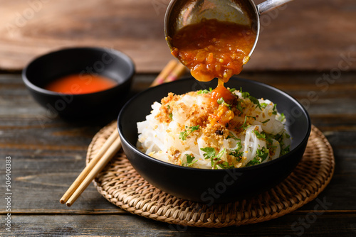 Rice noodle mixed with spicy tomatoes sauce, Tai Yai food in Northern of Thailand photo