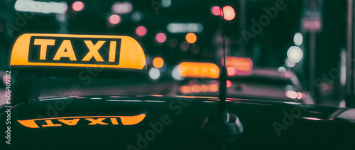 Fényképezés city taxi sign at night