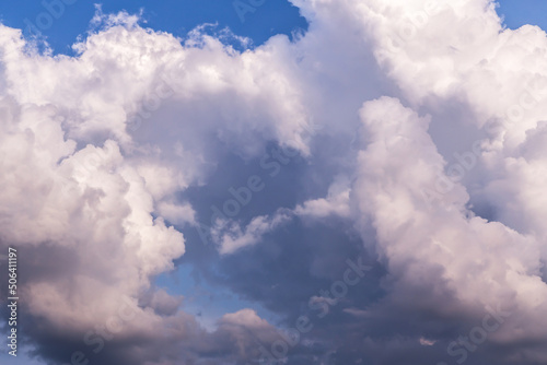 Epic Blue sky with big white fluffy cumulus storm clouds. Abstract background texture  