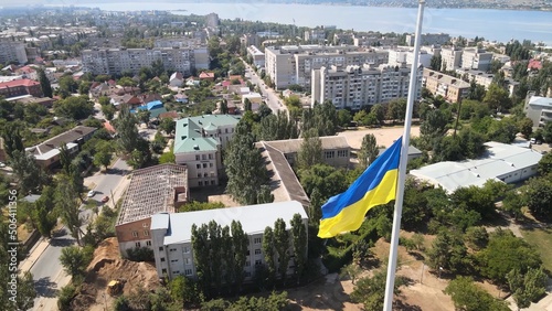 Ukrainian flag in Mykolaiv. Large ukrainian flag. Symbol of Ukraine  photo