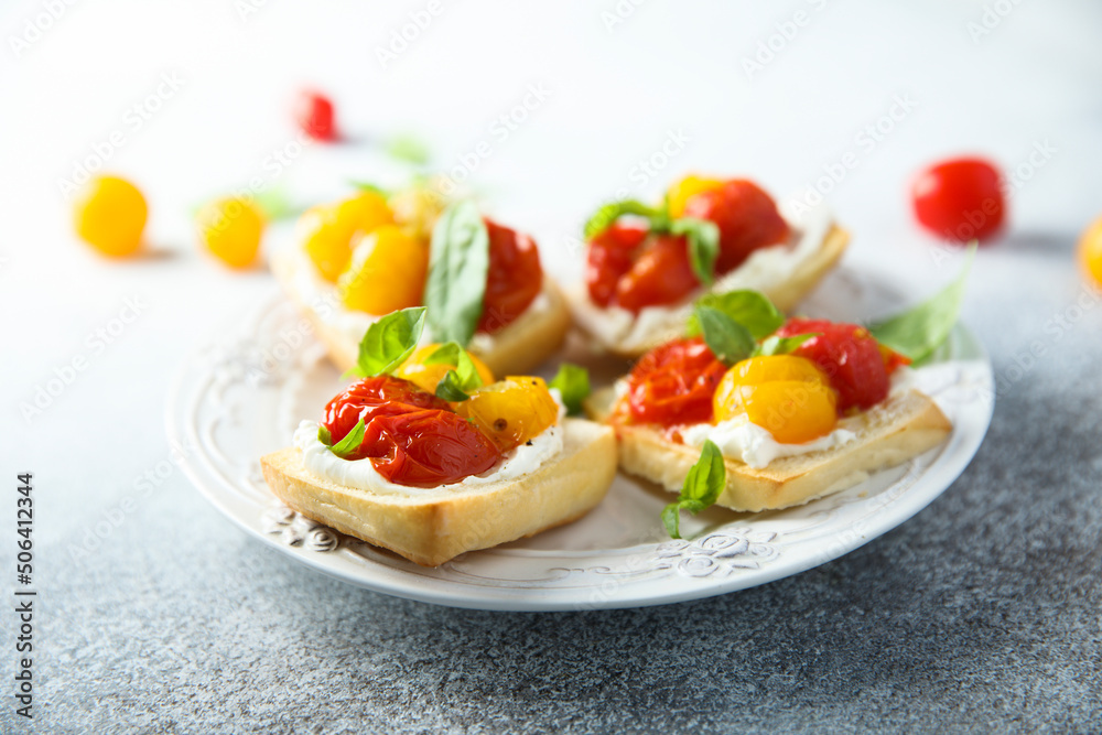 Tomato crostini with cream cheese and fresh basil Tomato crostini with cream cheese and fresh basil