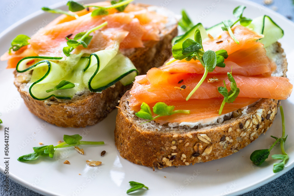 Open sandwich with cream cheese, salmon and cucumber.