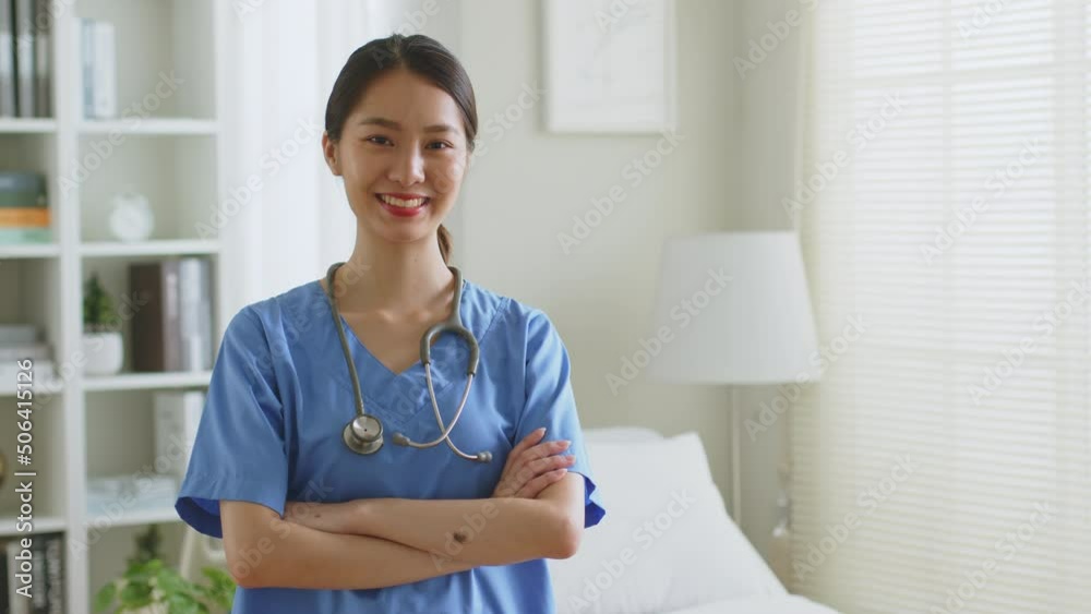 Portrait of young Asian woman nurse smiling in nursing home or hospital. Look at camera Portrait of young Asian woman nurse smiling in nursing home or hospital. Look at camera