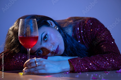 Portrait of young woman with a hangover after New Year party photo