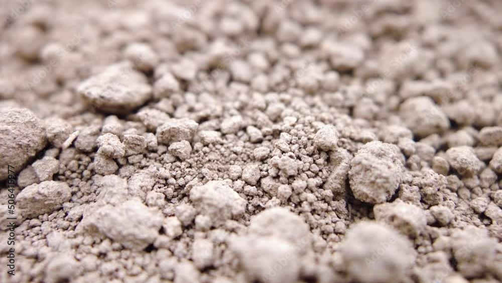 Cinematic close up of dry soil particles during droughts caused due to lack of rainfall. Cinematic close up of dry soil particles during droughts caused due to lack of rainfall.