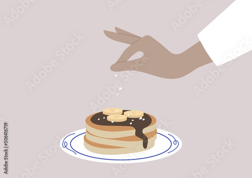 Pancakes on a plate with bananas and chocolate syrop, a traditional American sweet breakfast