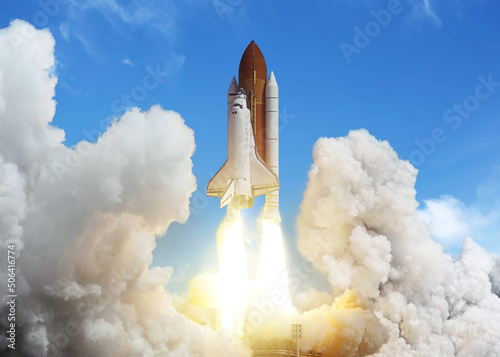 New space shuttle rocket successfully launches and takes off into the blue sky