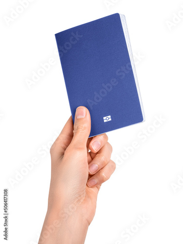 Hand holding blue passport isolated on white background. Documents, visa, citizenship or emigration concept