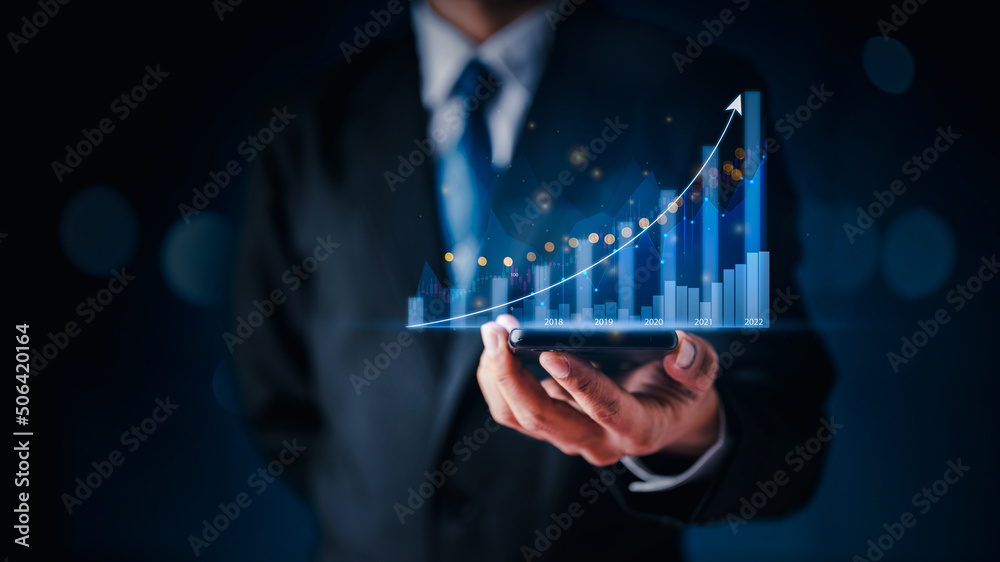 Businessman in suite showing rising sign Stock chart with graph indicator. financial data exchange Businessman in suite showing rising sign Stock chart with graph indicator. financial data exchange
