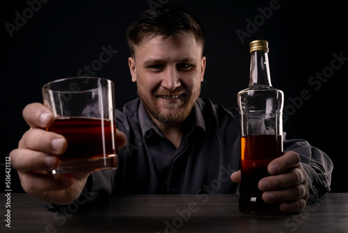 The man offers to drink alcohol with him.